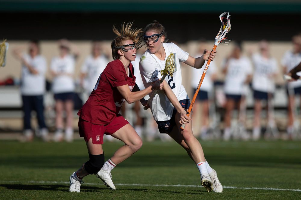 STANFORD, California - FEBRUARY 14: Virginia Cavaliers midfield Sammy Mueller (2) is defended by Stanford Cardinal midfield Jacie Lemos (33) during the first half at Cagan Stadium on February 14, 2020 in Stanford, California. The Virginia Cavaliers defeated the Stanford Cardinal 12-11. (Photo by Jason O. Watson)