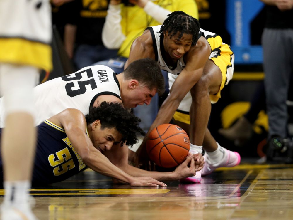 Iowa Hawkeyes forward Luka Garza (55) and guard Bakari Evelyn (4) against the Michigan Wolverines Friday, January 17, 2020 at Carver-Hawkeye Arena. (Brian Ray/hawkeyesports.com)