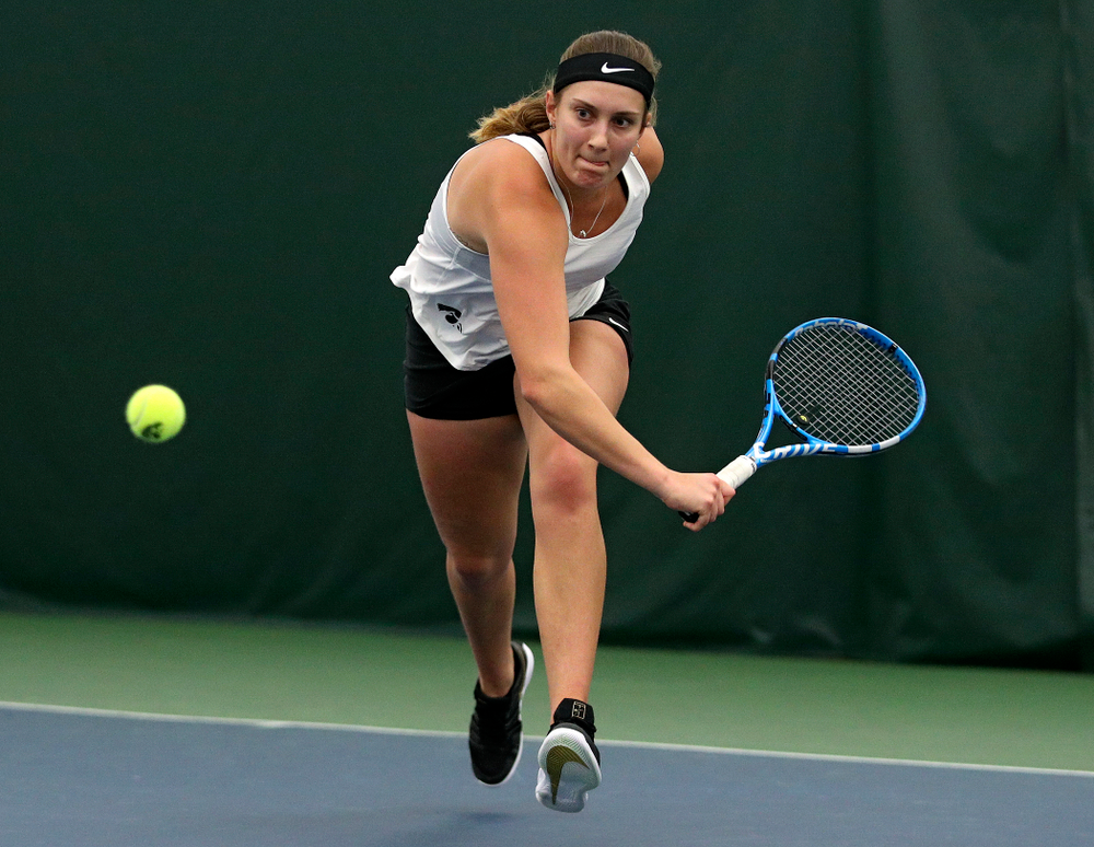 Iowa’s Ashleigh Jacobs returns a shot during her singles match at the Hawkeye Tennis and Recreation Complex in Iowa City on Sunday, February 23, 2020. (Stephen Mally/hawkeyesports.com)
