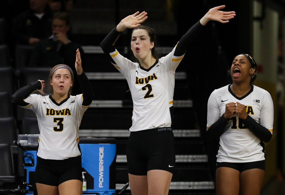 Iowa Hawkeyes defensive specialist Maddie Hine (3), Iowa Hawkeyes setter Courtney Buzzerio (2) and Iowa Hawkeyes outside hitter Griere Hughes (10) react after an ace during a match against Nebraska at Carver-Hawkeye Arena on November 7, 2018. (Tork Mason/hawkeyesports.com)