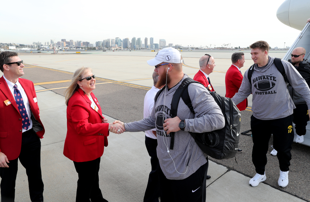 Iowa Hawkeyes offensive lineman Landan Paulsen (68) shakes hands with the ÒRed CoatsÓ after arriving in San Diego, CA Saturday, December 21, 2019 for the Holiday Bowl. (Brian Ray/hawkeyesports.com)