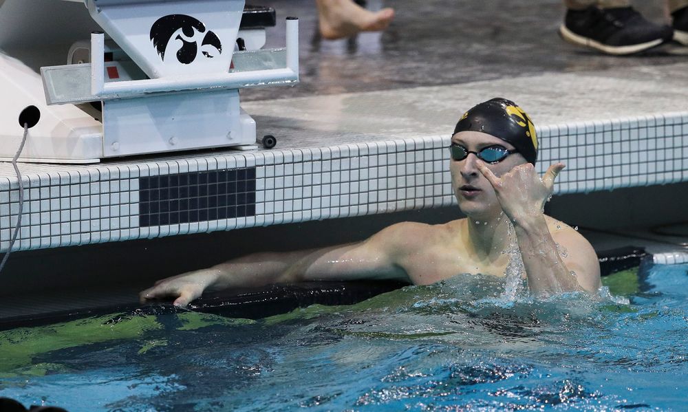 Iowa's Joe Myhre reacts after winning the 100-yard freestyle during a meet against Michigan and Denver at the Campus Recreation and Wellness Center on November 3, 2018. (Tork Mason/hawkeyesports.com)
