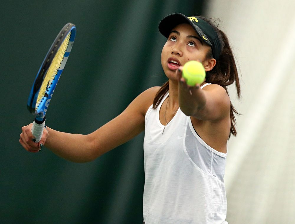 Iowa’s Michelle Bacalla serves during her doubles match at the Hawkeye Tennis and Recreation Complex in Iowa City on Sunday, February 23, 2020. (Stephen Mally/hawkeyesports.com)
