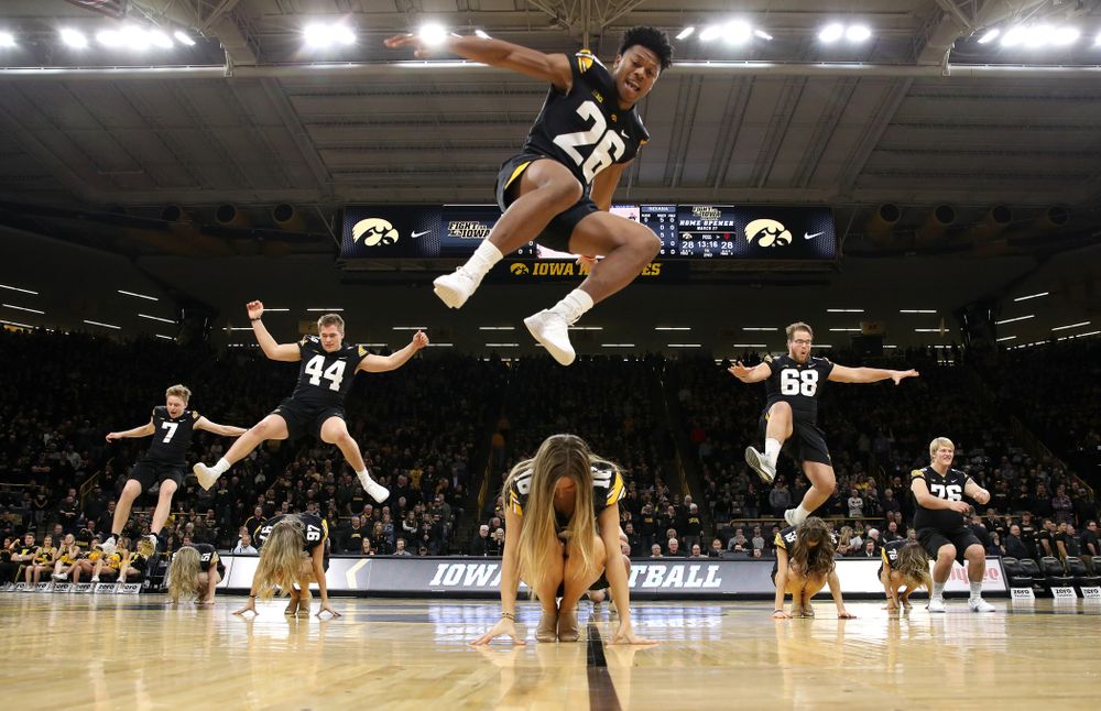 The Iowa Dance Team performs with the Iowa Football Team at halftime of the Iowa Hawkeyes game against the Indiana Hoosiers Friday, February 22, 2019 at Carver-Hawkeye Arena. (Brian Ray/hawkeyesports.com)