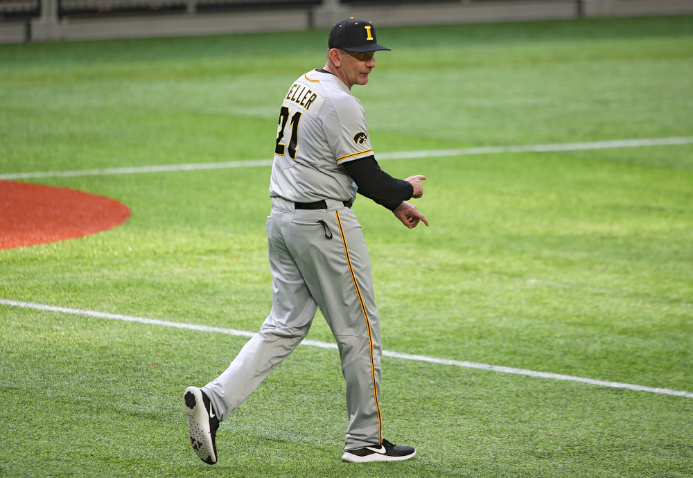 Iowa Hawkeyes head coach Rick Heller signals to bring in a relief pitcher during the eighth inning of their CambriaCollegeClassic game at U.S. Bank Stadium in Minneapolis, Minn. on Friday, February 28, 2020. (Stephen Mally/hawkeyesports.com)
