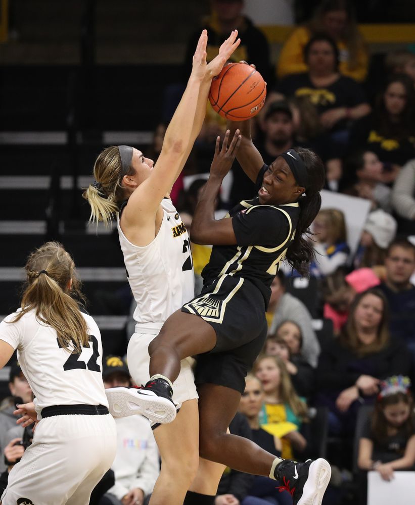 Iowa Hawkeyes forward Hannah Stewart (21) blocks a shot against the Purdue Boilermakers Sunday, January 27, 2019 at Carver-Hawkeye Arena. (Brian Ray/hawkeyesports.com)
