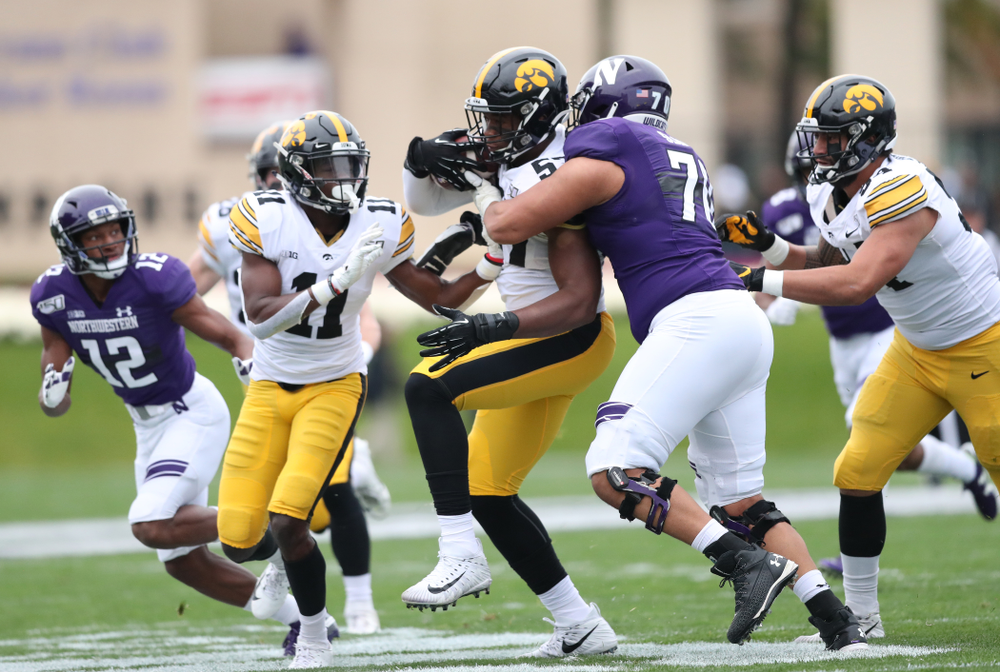 Iowa Hawkeyes defensive end Chauncey Golston (57) intercepts a pass against the Northwestern Wildcats Saturday, September 28, 2019 at Kinnick Stadium. (Max Allen/hawkeyesports.com)