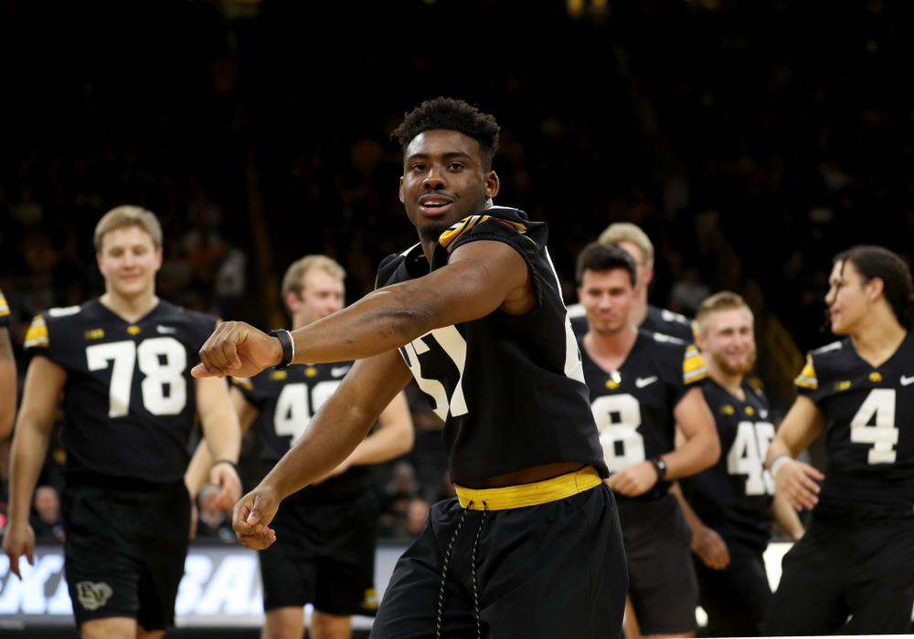 Members of the Hawkeye Football team performs with the Iowa Dance Team at halftime of the Iowa Hawkeyes game against the Ohio State Buckeyes Thursday, February 20, 2020 at Carver-Hawkeye Arena. (Brian Ray/hawkeyesports.com)
