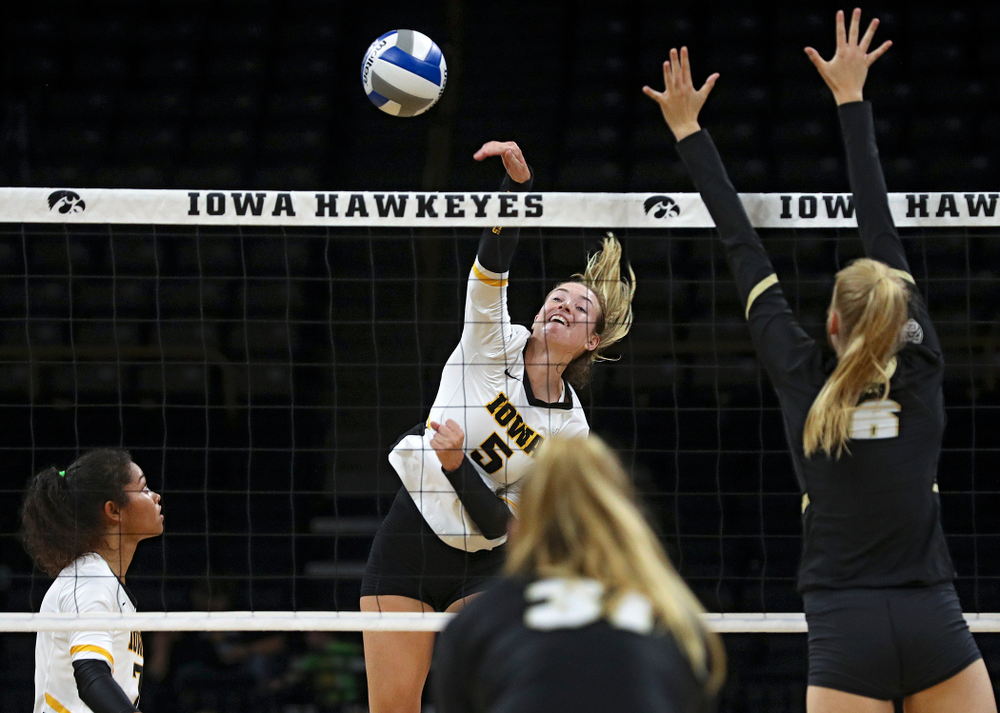Iowa’s Meghan Buzzerio (5) goes up for a kill during the first set of their Big Ten/Pac-12 Challenge match against Colorado at Carver-Hawkeye Arena in Iowa City on Friday, Sep 6, 2019. (Stephen Mally/hawkeyesports.com)