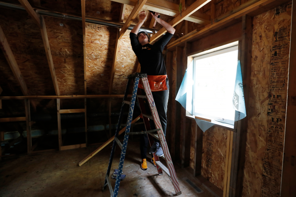 Iowa Hawkeyes forward Megan Gustafson (10) works on the Habitat for Humanity Women's Build Wednesday, September 26, 2018 in Iowa City. (Brian Ray/hawkeyesports.com)