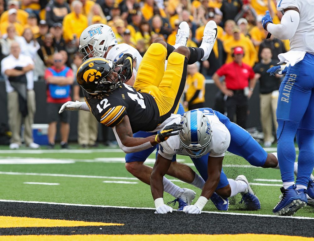 Iowa Hawkeyes wide receiver Brandon Smith (12) on a 10-yard touchdown reception during fourth quarter of their game at Kinnick Stadium in Iowa City on Saturday, Sep 28, 2019. (Stephen Mally/hawkeyesports.com)