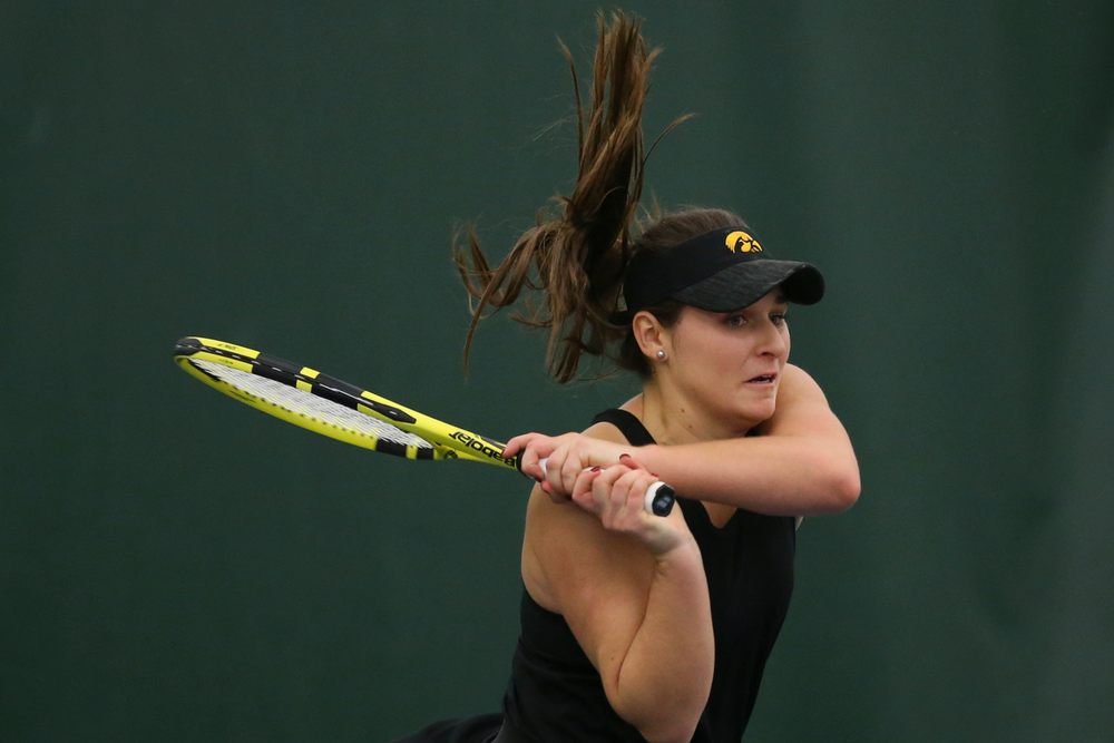 Iowa’s Danielle Bauers returns a hit during the Iowa women’s tennis meet vs UNI on Saturday, February 29, 2020 at the Hawkeye Tennis and Recreation Complex. (Lily Smith/hawkeyesports.com)