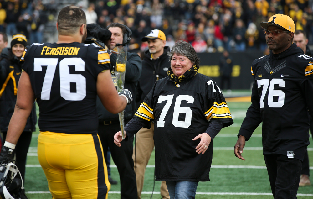 Iowa Hawkeyes offensive lineman Dalton Ferguson (76) is greeted by his parents during Senior Day ceremonies before a game against Nebraska at Kinnick Stadium on November 23, 2018. (Tork Mason/hawkeyesports.com)