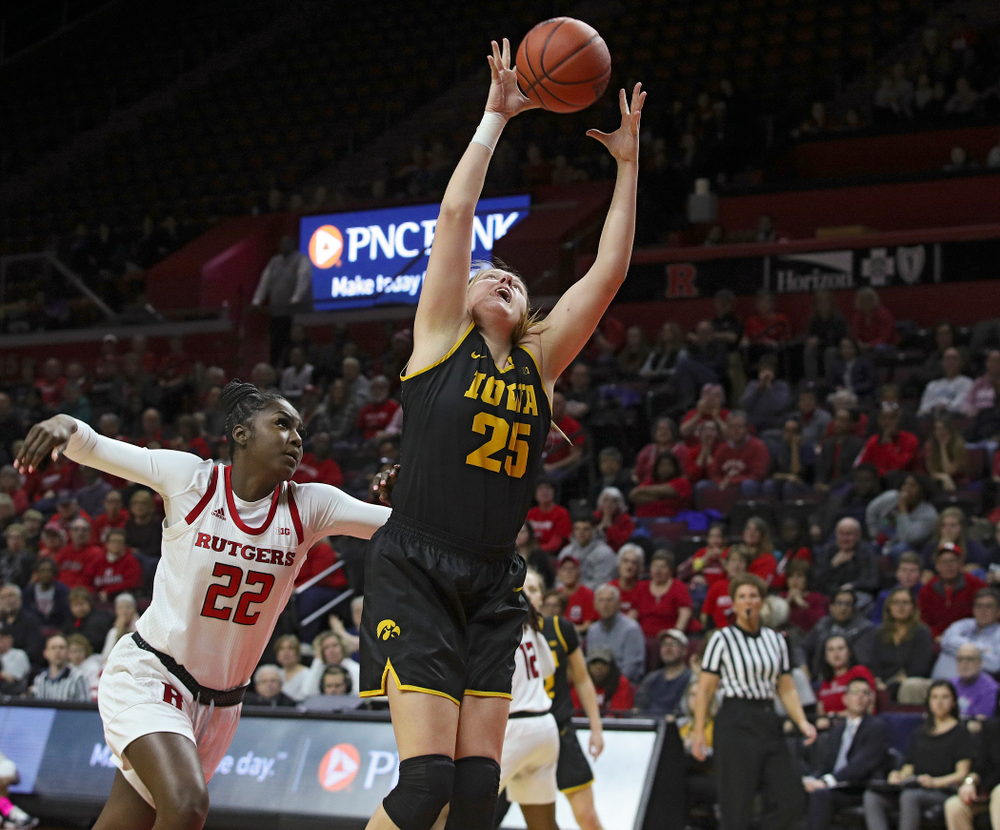 Iowa forward/center Monika Czinano (25) pulls in a pass during the fourth quarter of their game at the Rutgers Athletic Center in Piscataway, N.J. on Sunday, March 1, 2020. (Stephen Mally/hawkeyesports.com)