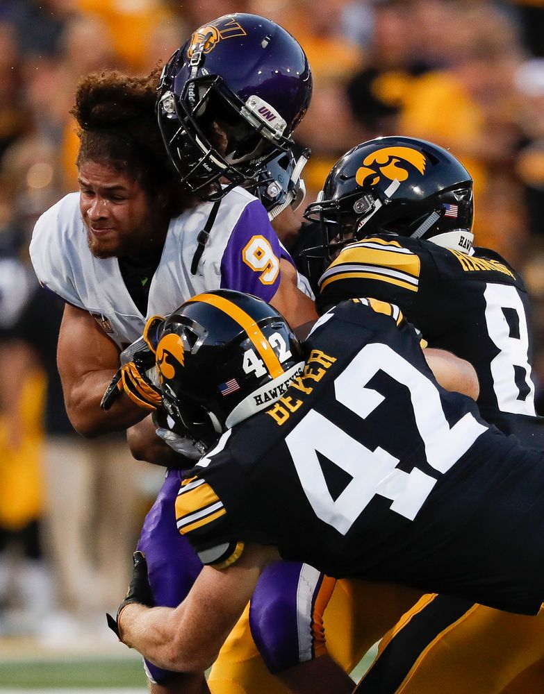 Iowa Hawkeyes tight end Shaun Beyer (42) and Iowa Hawkeyes defensive back Matt Hankins (8) tackle Northern Iowa's Xavier Williams (9) on a kickoff during a game against Northern Iowa at Kinnick Stadium on September 15, 2018. (Tork Mason/hawkeyesports.com)