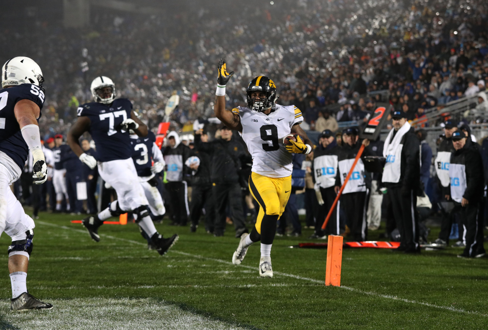 Iowa Hawkeyes defensive back Geno Stone (9) takes an interception back for a touchdown against the Penn State Nittany Lions Saturday, October 27, 2018 at Beaver Stadium in University Park, Pa. (Brian Ray/hawkeyesports.com)