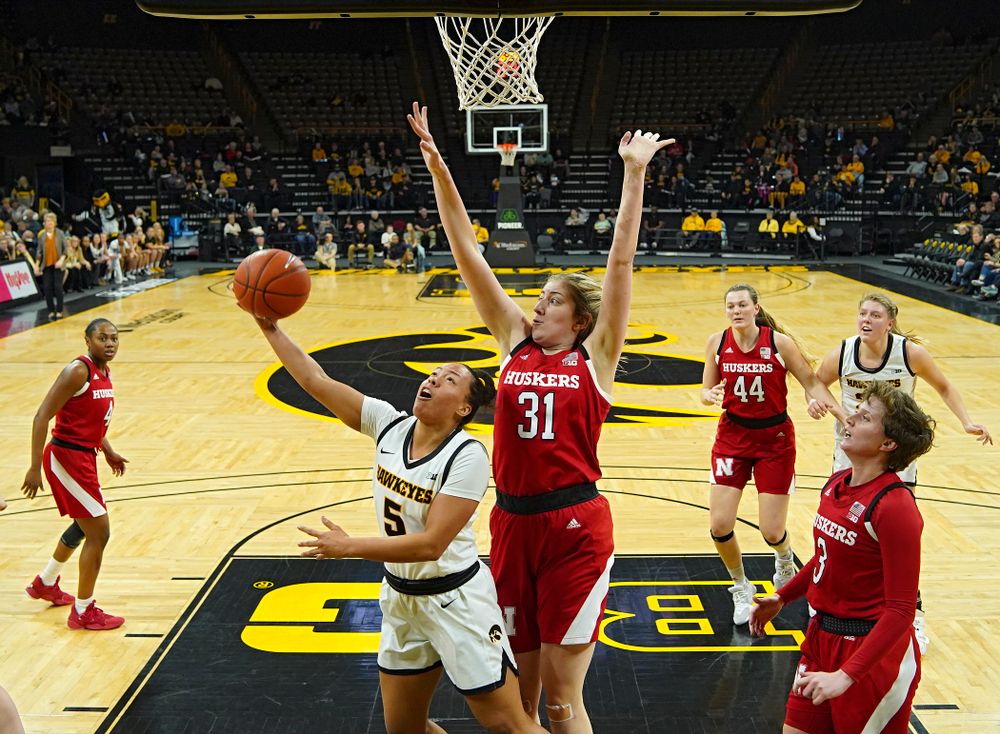 Iowa Hawkeyes guard Alexis Sevillian (5) makes a basket during the second quarter of the game at Carver-Hawkeye Arena in Iowa City on Thursday, February 6, 2020. (Stephen Mally/hawkeyesports.com)