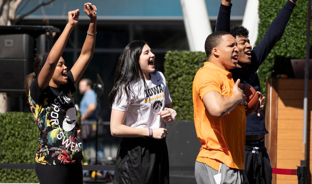 Iowa Hawkeyes forward Megan Gustafson (10) cheers on the athletes during a Special Olympics Event Friday, April 12, 2019 in the XBOX Plaza at LA Live. (Brian Ray/hawkeyesports.com)