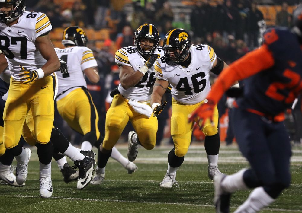 Iowa Hawkeyes running back Toren Young (28) runs behind fullback Austin Kelly (46) against the Illinois Fighting Illini Saturday, November 17, 2018 at Memorial Stadium in Champaign, Ill. (Brian Ray/hawkeyesports.com)