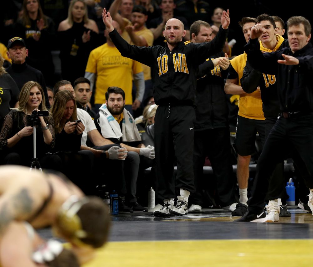 Alex Marinelli cheers as Iowa’s Abe Assad wrestles Ohio State’s Rockey Jordan at 184 pounds Friday, January 24, 2020 at Carver-Hawkeye Arena. Assad won the match 3-1. (Brian Ray/hawkeyesports.com)