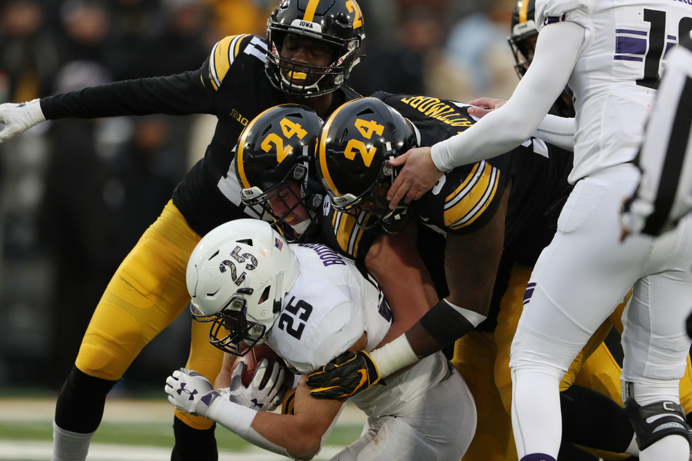 Iowa Hawkeyes defensive lineman Brady Reiff (91) and defensive lineman Cedrick Lattimore (95) against the Northwestern Wildcats Saturday, November 10, 2018 at Kinnick Stadium. (Brian Ray/hawkeyesports.com)