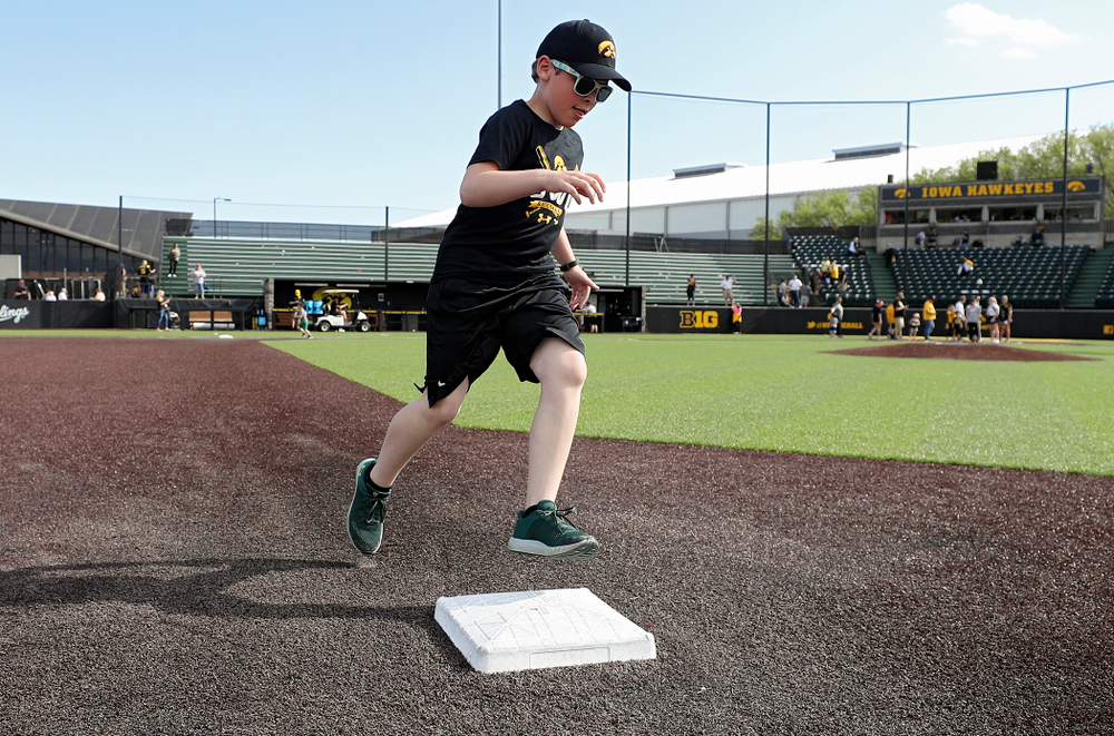 Kids run the bases after Iowa's game against UC Irvine at Duane Banks Field in Iowa City on Sunday, May. 5, 2019. (Stephen Mally/hawkeyesports.com)