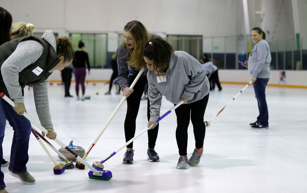Members of the Iowa Softball team learn the sport of curling as part of a team building event Wednesday, January 10, 2018 at the Cedar Rapids Ice Arena. (Brian Ray/hawkeyesports.com)