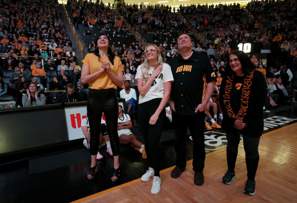 Megan Gustafson watches a video message from her teammates and coaches after her number was raised into the rafters during a jersey retirement ceremony Sunday, January 26, 2020 at Carver-Hawkeye Arena. (Brian Ray/hawkeyesports.com)