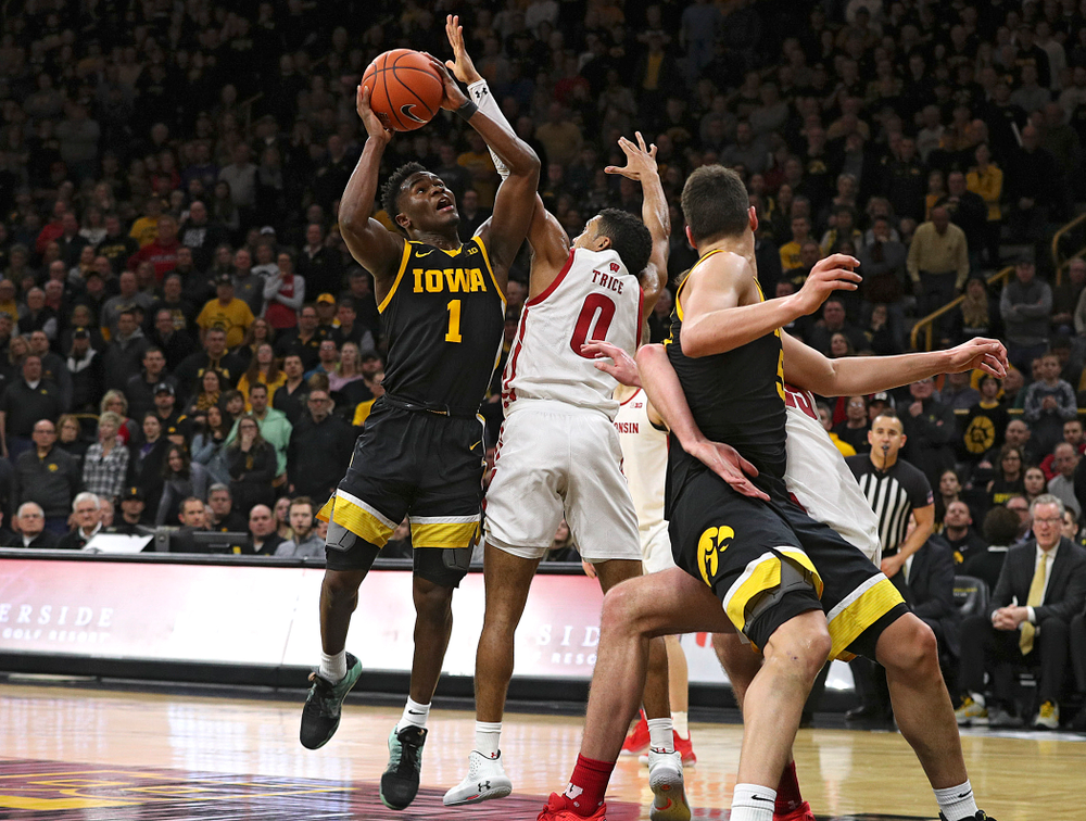 Iowa Hawkeyes guard Joe Toussaint (1) makes a basket while being fouled during the second half of their game at Carver-Hawkeye Arena in Iowa City on Monday, January 27, 2020. (Stephen Mally/hawkeyesports.com)