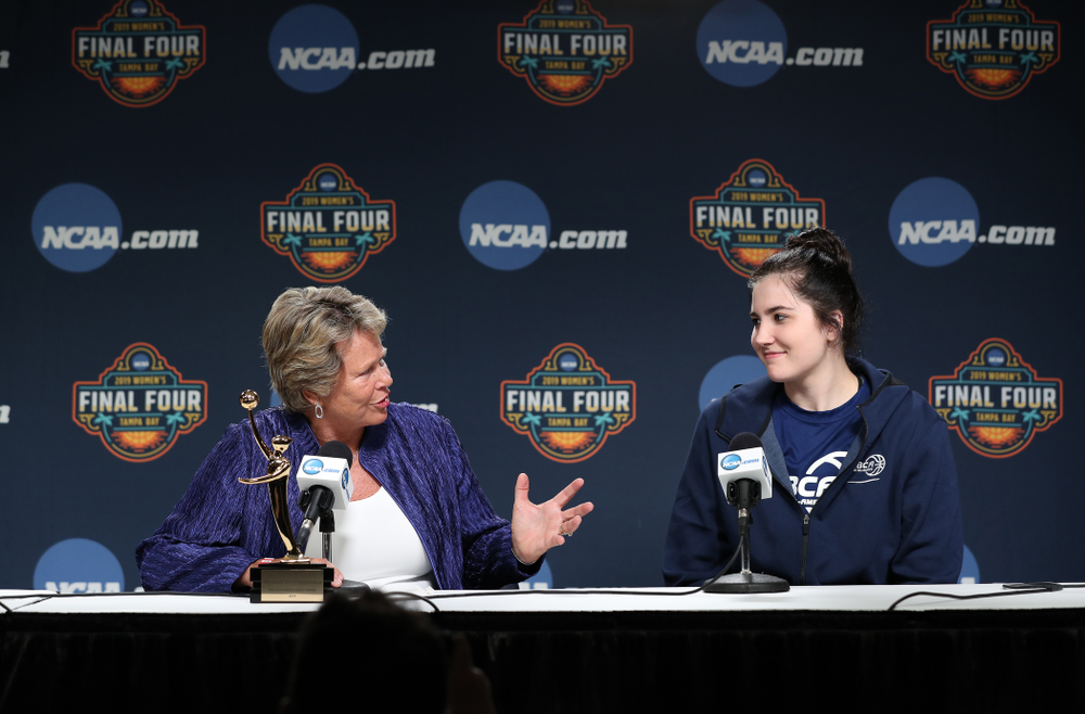 Iowa Hawkeyes forward Megan Gustafson (10) receives US Basketball Writers Association Ann Meyers Drysdale Player of the Year award from Ann Meyers Drysdale during a news conference Friday, April 5, 2019 at Amalie Arena in Tampa, FL. (Brian Ray/hawkeyesports.com)