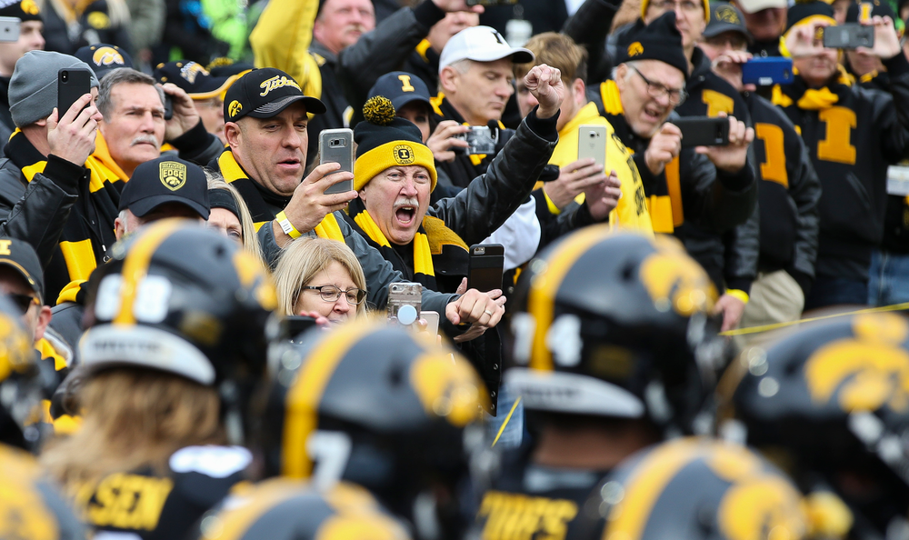 Former Hawkeye All-Americans form a tunnel for The Swarm before a game against Nebraska at Kinnick Stadium on November 23, 2018. (Tork Mason/hawkeyesports.com)