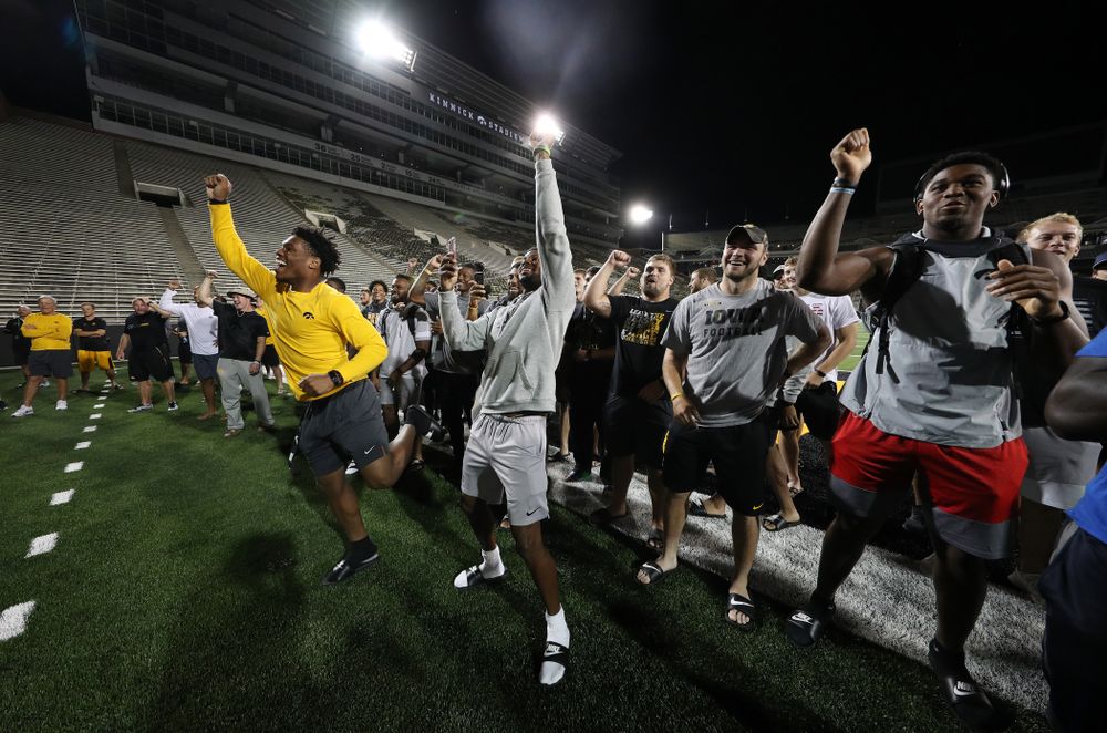 Members o the Iowa Football Team cheer on the new players as they sing the ÒFight SongÓ Thursday, August 22, 2019 at Kinnick Stadium in Iowa City. (Brian Ray/hawkeyesports.com)