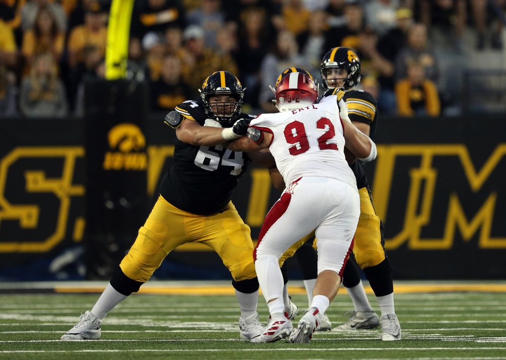 Iowa Hawkeyes offensive lineman Kyler Schott (64) blocks against the Miami RedHawks Saturday, August 31, 2019 at Kinnick Stadium in Iowa City. (Brian Ray/hawkeyesports.com)