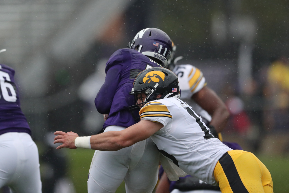 Iowa Hawkeyes linebacker Joe Evans (13) gets his first career sack against the Northwestern Wildcats Saturday, October 26, 2019 at Ryan Field in Evanston, Ill. (Brian Ray/hawkeyesports.com)