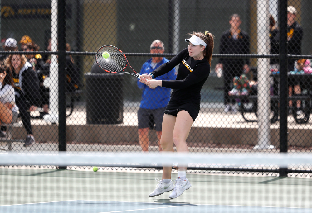 Elise Van Heuvelen and Anastasia Reimchen play a doubles match against the Wisconsin Badgers Sunday, April 22, 2018 at the Hawkeye Tennis and Recreation Center. (Brian Ray/hawkeyesports.com)