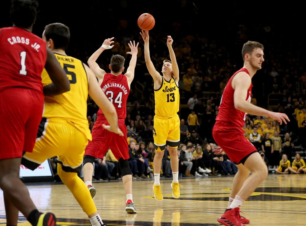 Iowa Hawkeyes guard Austin Ash (13) knocks down a three point basket against the Nebraska Cornhuskers Saturday, February 8, 2020 at Carver-Hawkeye Arena. (Brian Ray/hawkeyesports.com)