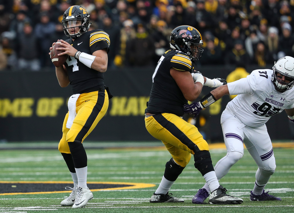 Iowa Hawkeyes quarterback Nate Stanley (4) drops back to pass during a game against Northwestern at Kinnick Stadium on November 10, 2018. (Tork Mason/hawkeyesports.com)