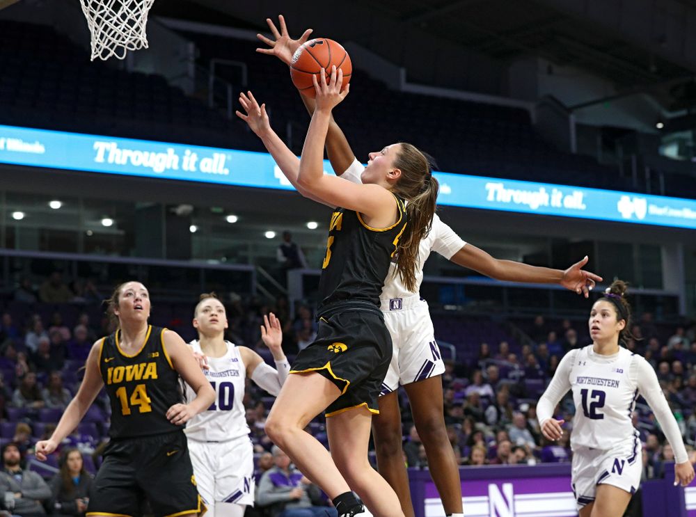Iowa Hawkeyes forward Amanda Ollinger (43) scores a basket during the third quarter of their game at Welsh-Ryan Arena in Evanston, Ill. on Sunday, January 5, 2020. (Stephen Mally/hawkeyesports.com)