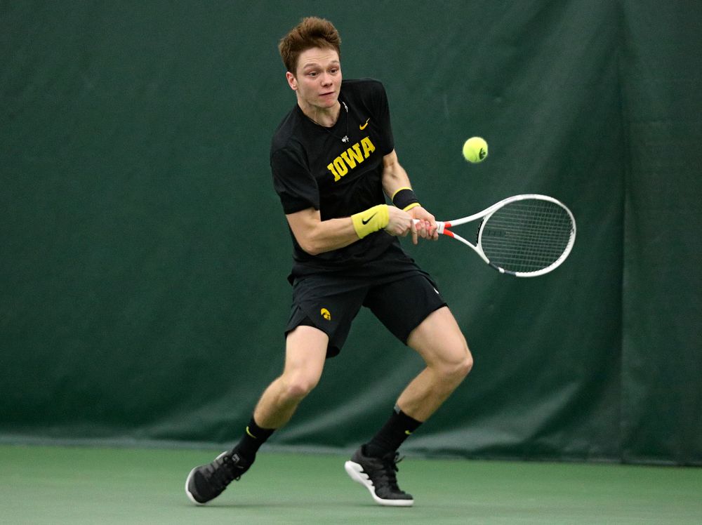 Iowa’s Jason Kerst returns a shot during his singles match at the Hawkeye Tennis and Recreation Complex in Iowa City on Friday, March 6, 2020. (Stephen Mally/hawkeyesports.com)