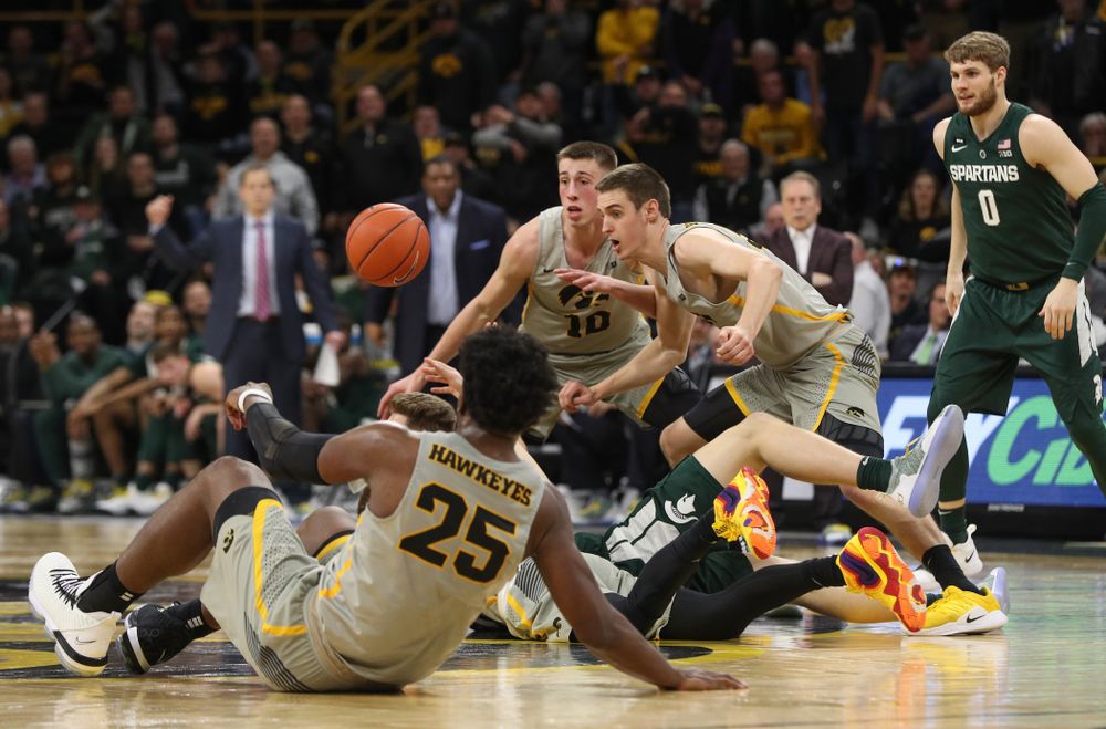 Iowa Hawkeyes forward Nicholas Baer (51) and guard Joe Wieskamp (10) against the Michigan State Spartans Thursday, January 24, 2019 at Carver-Hawkeye Arena. (Brian Ray/hawkeyesports.com)