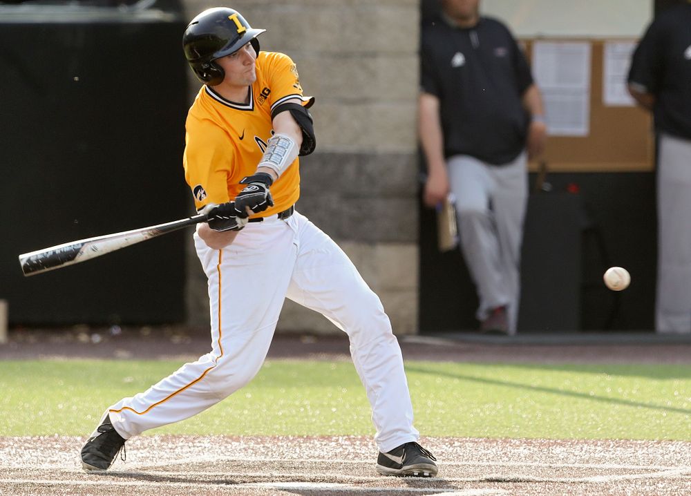 Iowa Hawkeyes catcher Brett McCleary (32) hits a single during the fourth inning of their game against Northern Illinois at Duane Banks Field in Iowa City on Tuesday, Apr. 16, 2019. (Stephen Mally/hawkeyesports.com)