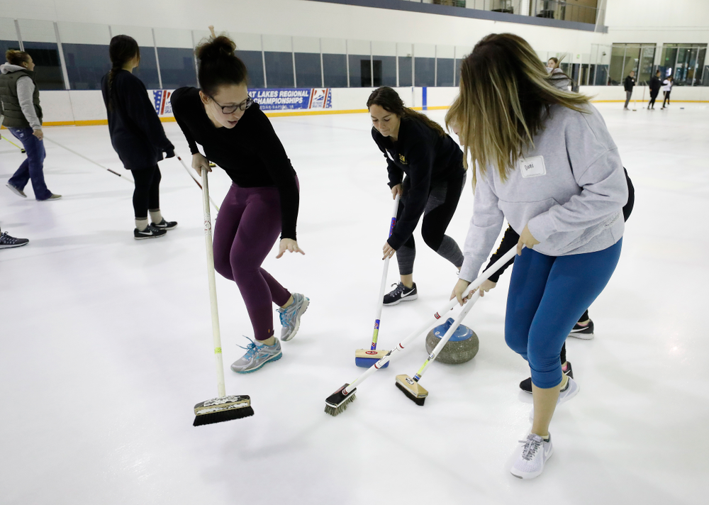Members of the Iowa Softball team learn the sport of curling as part of a team building event Wednesday, January 10, 2018 at the Cedar Rapids Ice Arena. (Brian Ray/hawkeyesports.com)