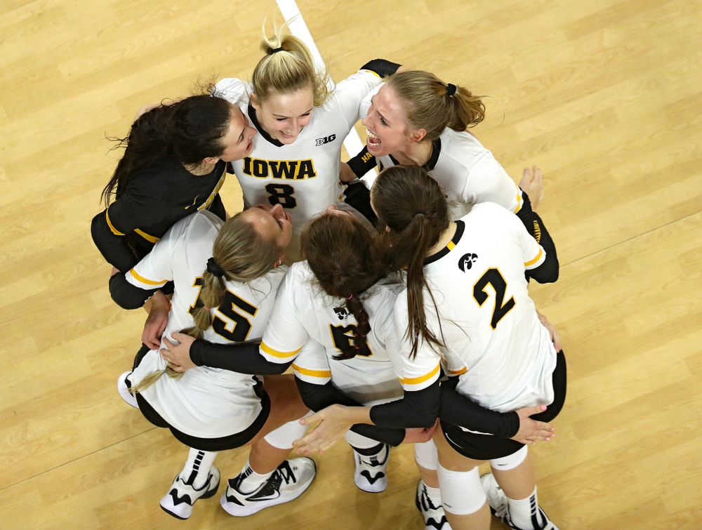 Iowa’s Halle Johnston (from left), Maddie Slagle (15), Kyndra Hansen (8), Emma Lowes (6), Courtney Buzzerio (2), and Hannah Clayton (18) celebrate a score during the third set of their match at Carver-Hawkeye Arena in Iowa City on Saturday, Nov 30, 2019. (Stephen Mally/hawkeyesports.com)