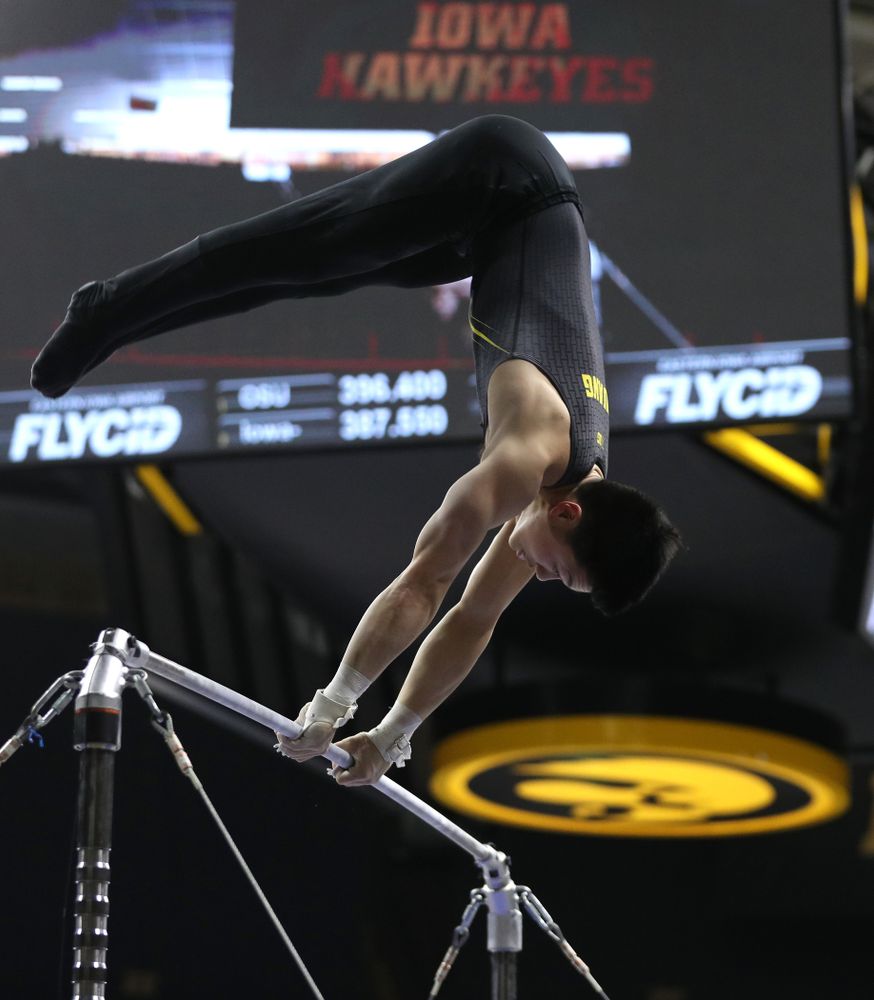 Iowa's Bennet Huang competes on the high bar against the Ohio State Buckeyes Saturday, March 16, 2019 at Carver-Hawkeye Arena. (Brian Ray/hawkeyesports.com)