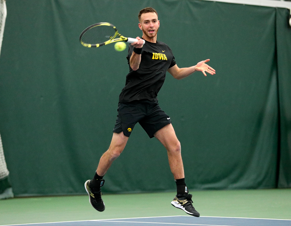 Iowa’s Kareem Allaf returns a shot during his singles match at the Hawkeye Tennis and Recreation Complex in Iowa City on Friday, February 14, 2020. (Stephen Mally/hawkeyesports.com)
