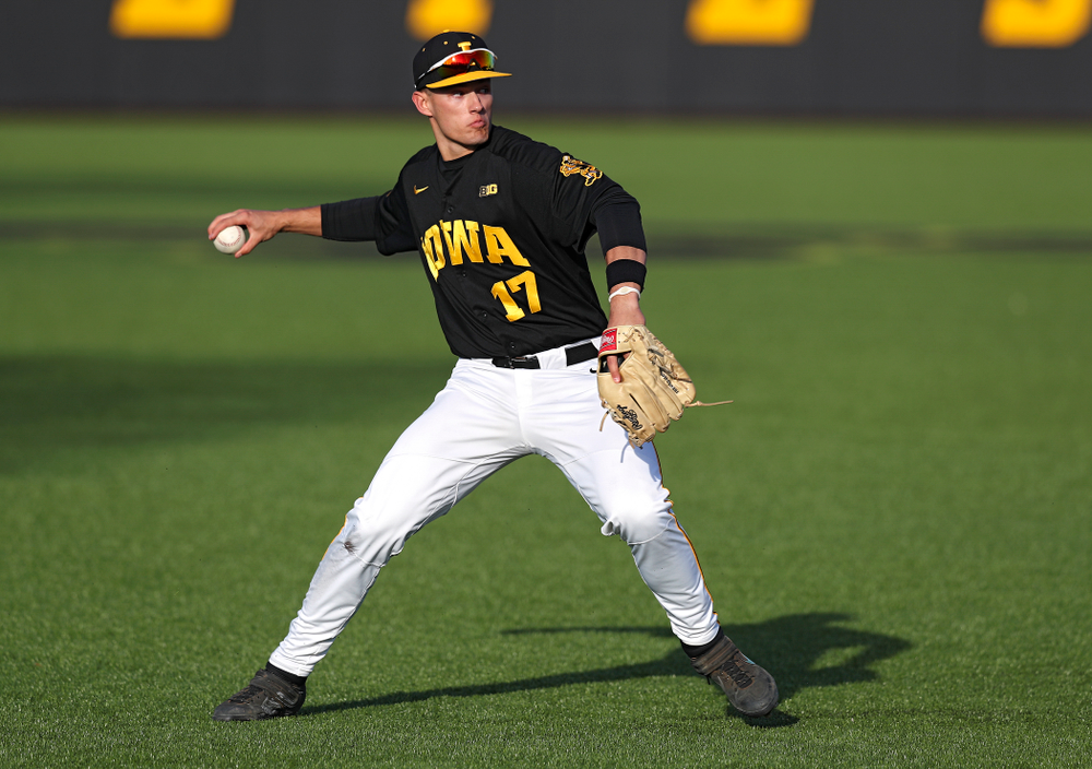 Iowa shortstop Dylan Nedved (17) throws to first for an out during the fifth inning of their college baseball game at Duane Banks Field in Iowa City on Tuesday, March 10, 2020. (Stephen Mally/hawkeyesports.com)