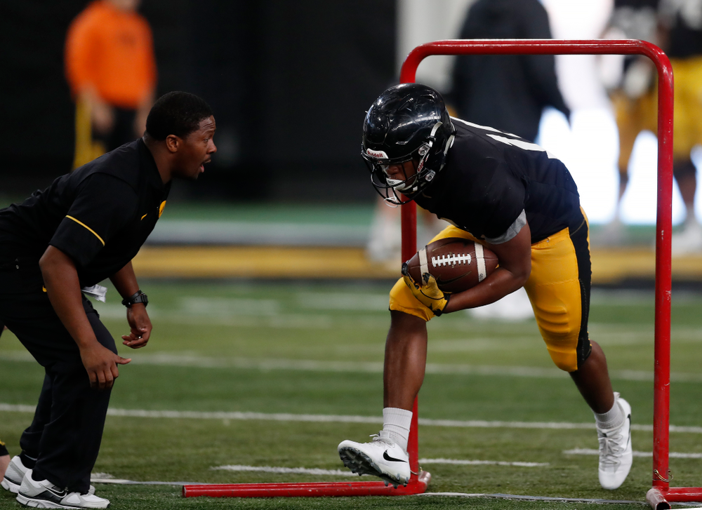 Iowa Hawkeyes running back Kyshaun Bryan (16) and running backs coach Derrick Foster during spring practice Wednesday, March 28, 2018 at the Hansen Football Performance Center. (Brian Ray/hawkeyesports.com)