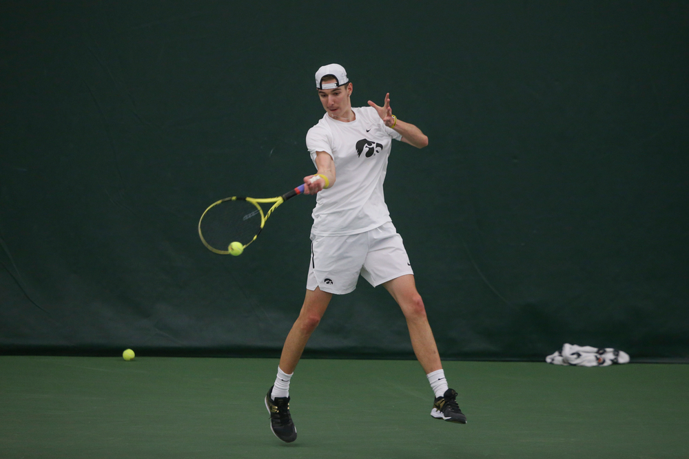 Iowa’s Nikita Snezhko returns a hit during the Iowa men’s tennis meet vs Nebraska on Sunday, March 1, 2020 at the Hawkeye Tennis and Recreation Complex. (Lily Smith/hawkeyesports.com)