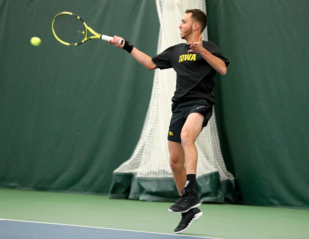 Iowa’s Kareem Allaf returns a shot during their match at the Hawkeye Tennis and Recreation Complex in Iowa City on Thursday, January 16, 2020. (Stephen Mally/hawkeyesports.com)