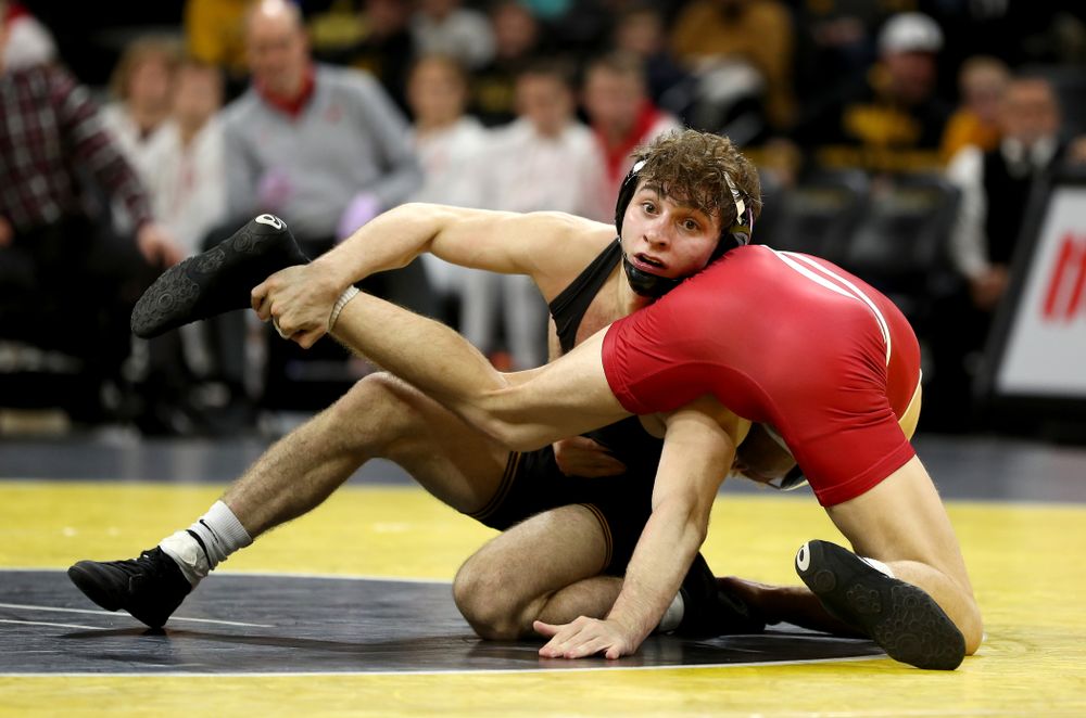 IowaÕs Austin DeSanto wrestles WisconsinÕs Seth Gross at 133 pounds Sunday, December 1, 2019 at Carver-Hawkeye Arena. DeSanto won the match 6-2. (Brian Ray/hawkeyesports.com)